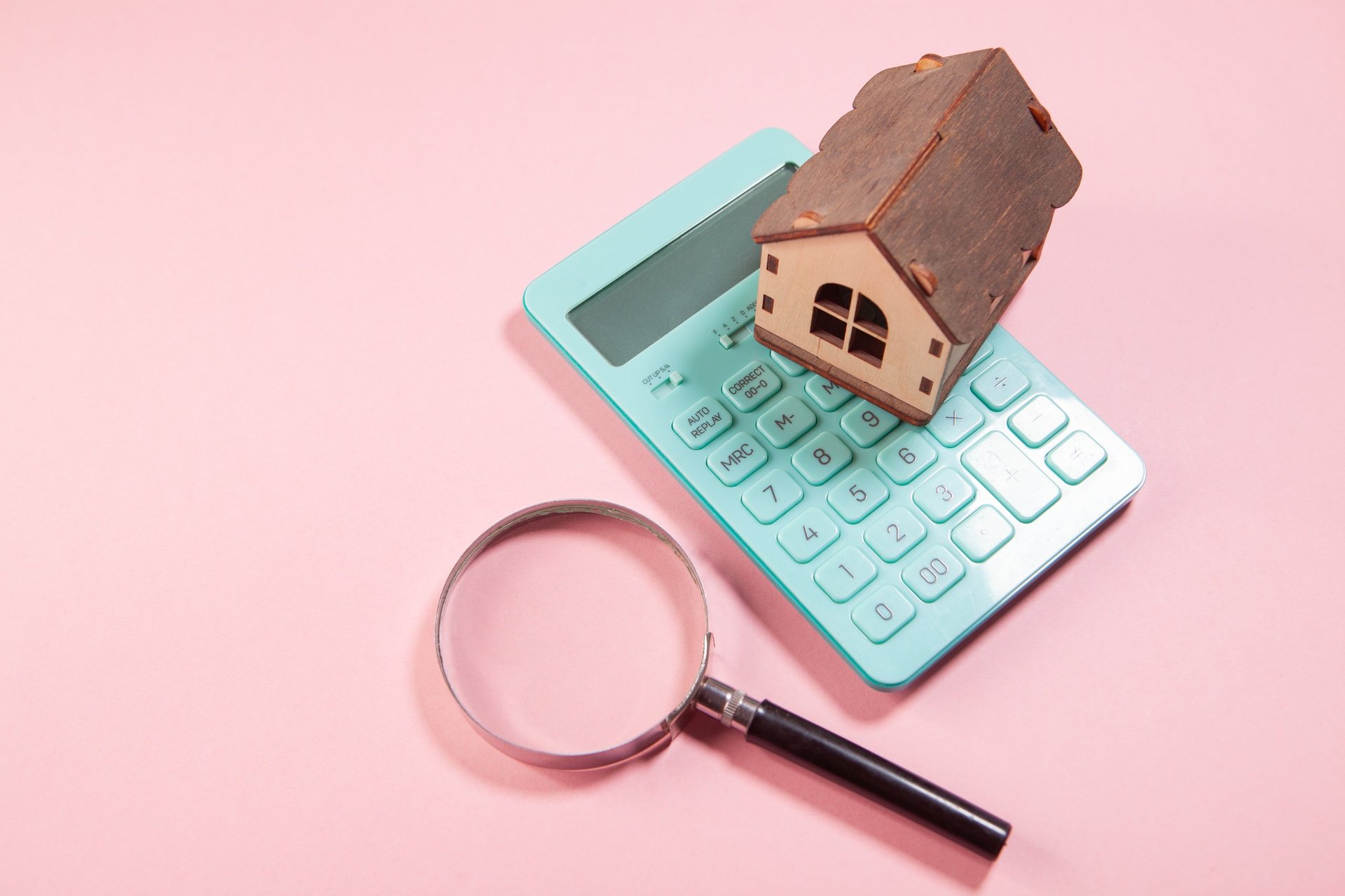 Calculator and financial planning documents representing home valuation