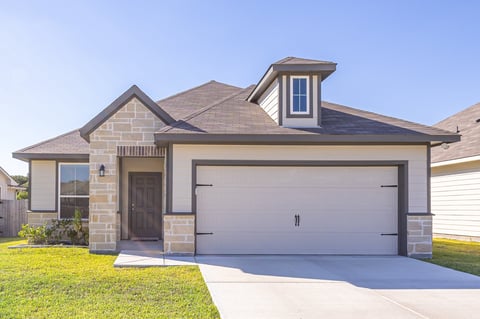Charming traditional suburban house with landscaped front yard and great curb appeal
