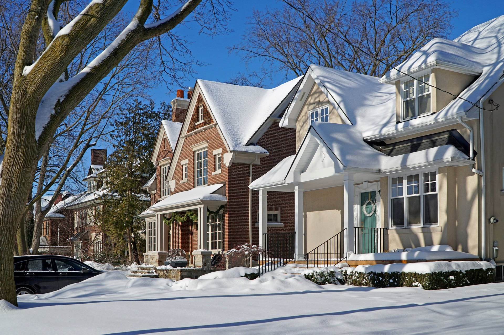 suburban street on a sunny day after a snow storm