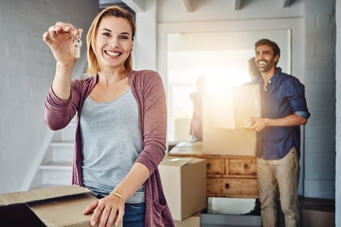Portrait of a couple moving into their new home